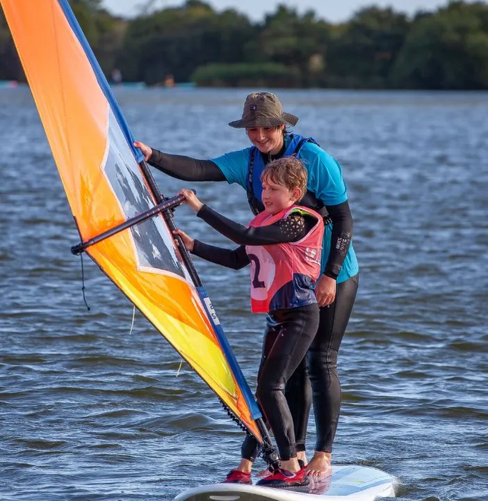 Child Windsurfing with Instructor